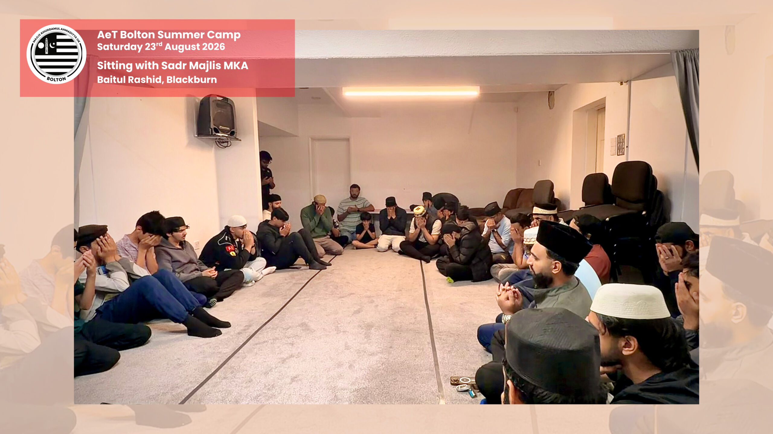 Khuddam in circle in a sitting with Respected Sadr Majlis Khuddam-ul-Ahmadiyya UK